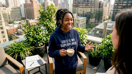 Developer wearing motto hoodie in startup lounge
