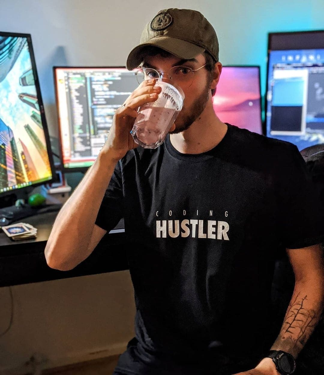 Justin wearing the Coding Hustler t-shirt by DevHero